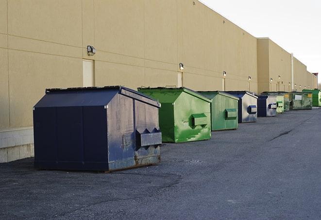 a collection of bright and vibrant dumpsters in a construction zone in Amlin OH